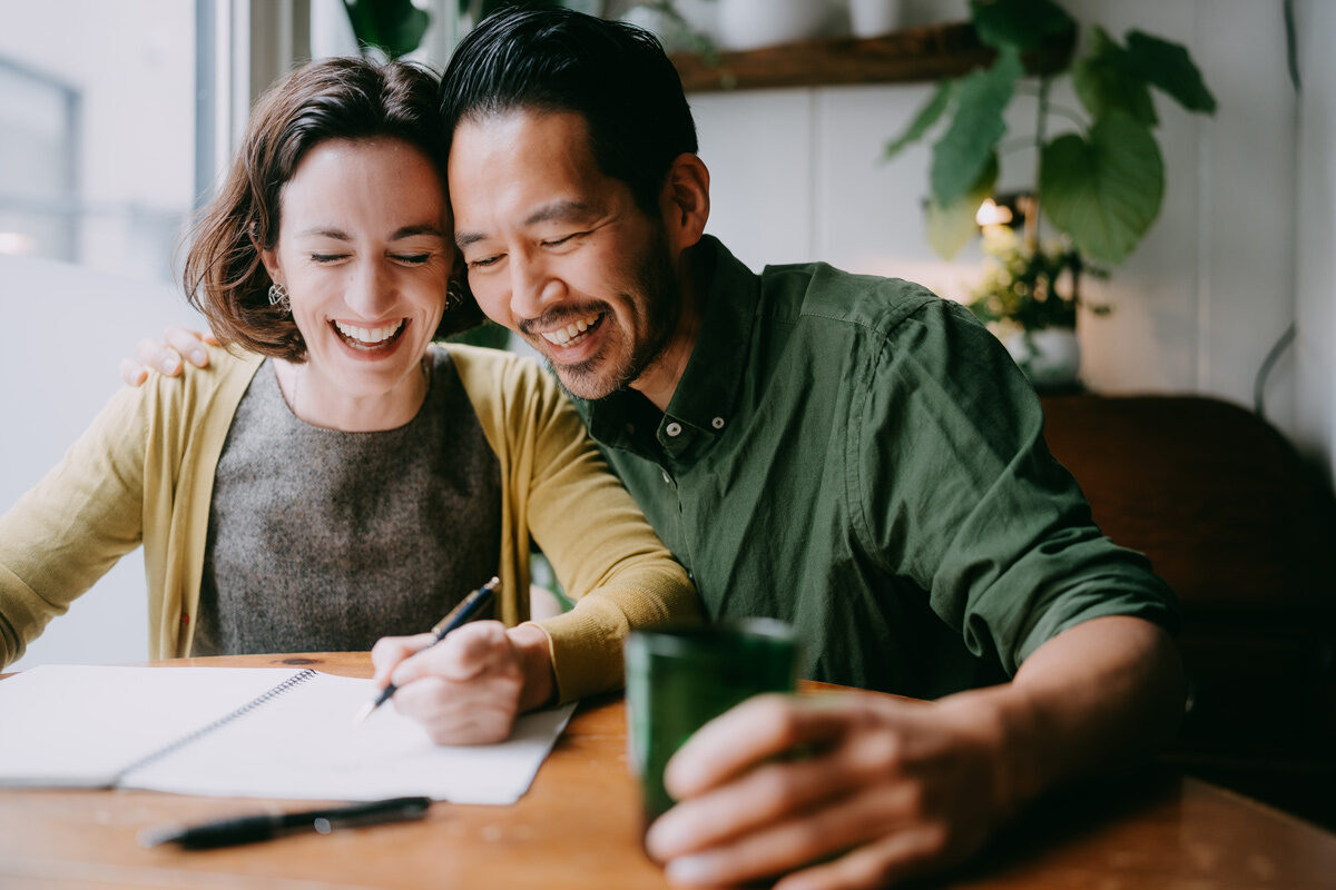 Man and women looking through and signing documents