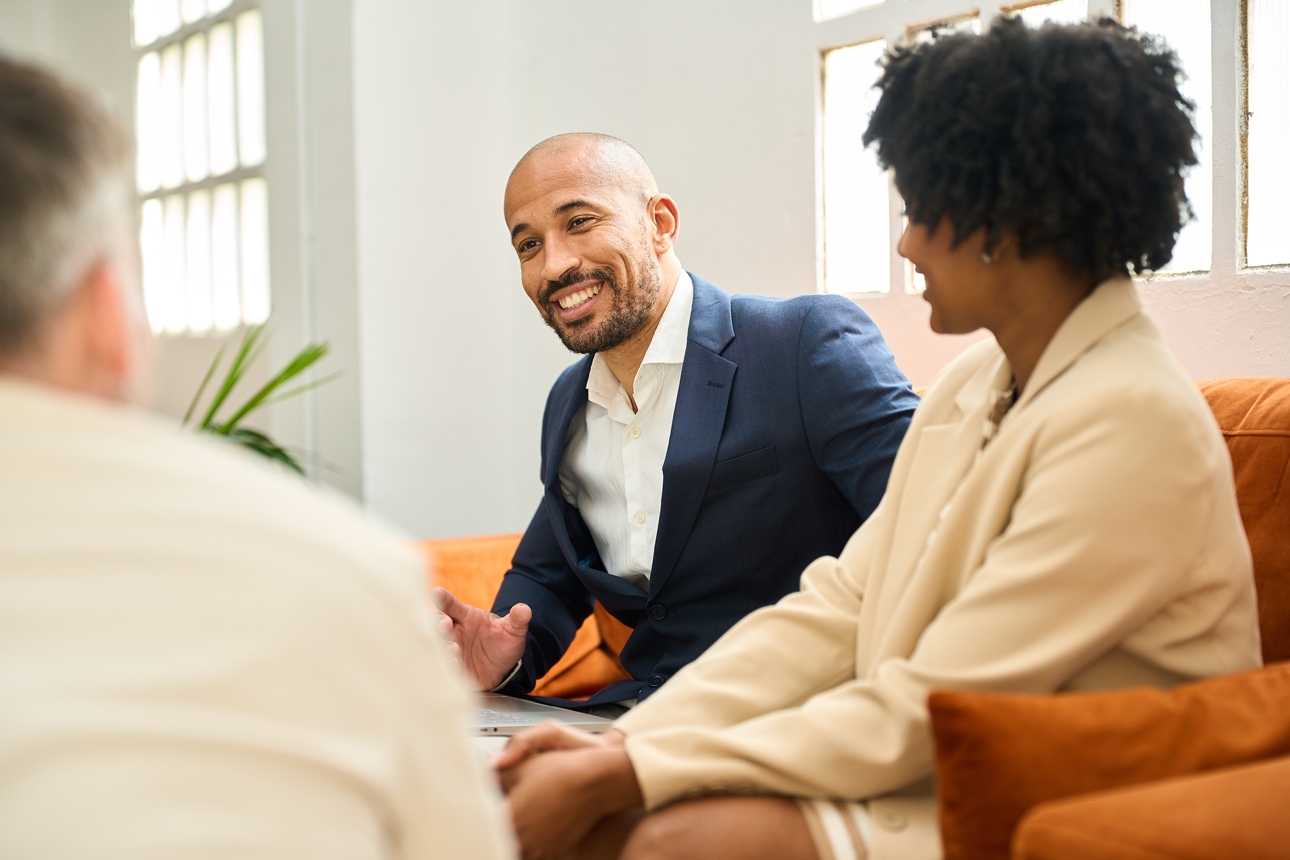 Male adviser speaking to female and male