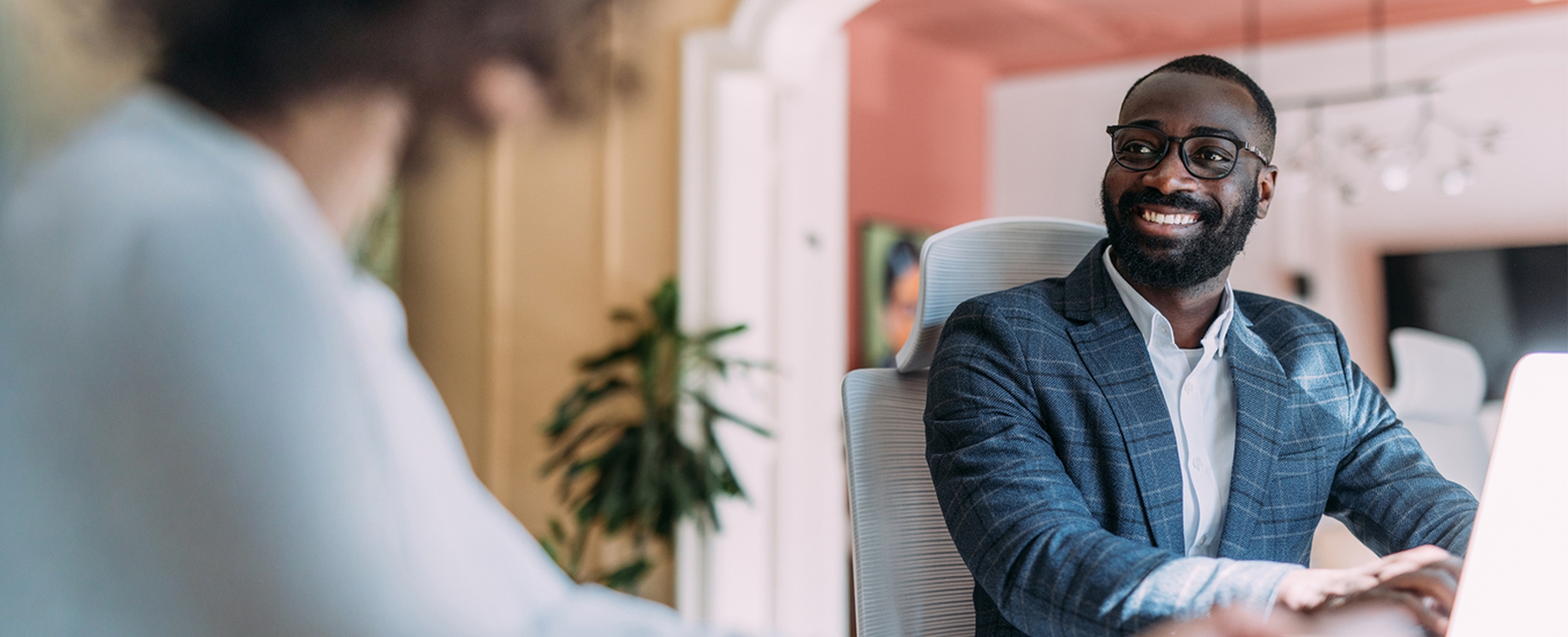 Male adviser speaking with female
