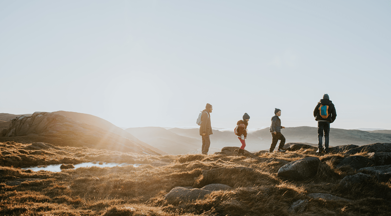 Group of people walking in the hills