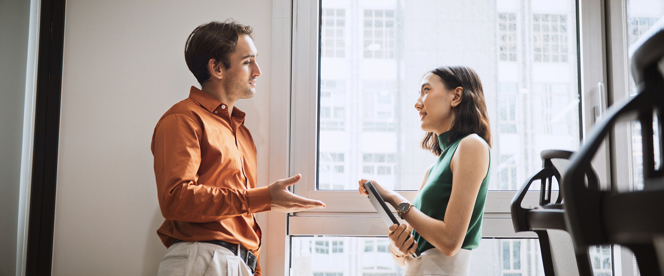 Man and women chatting in the office