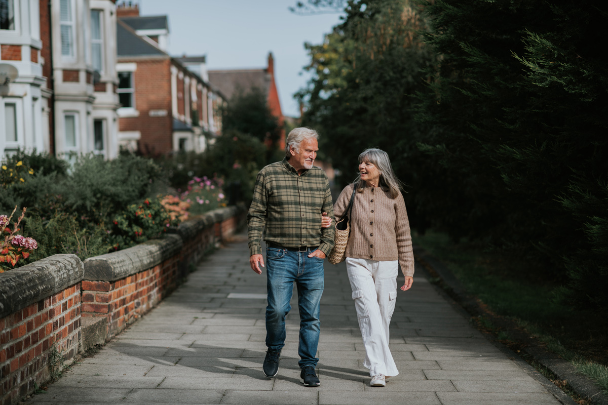 Man and women walking down the street