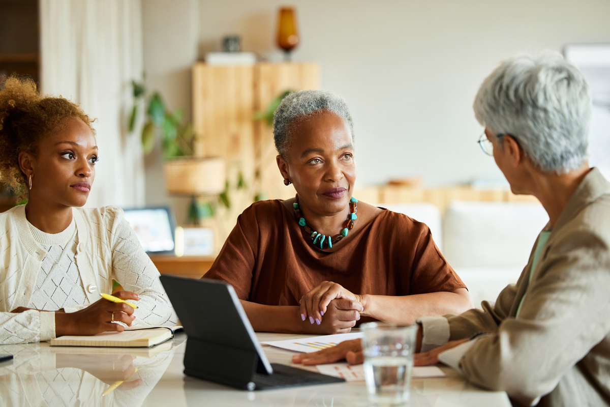 Mother and daughter talking to their adviser