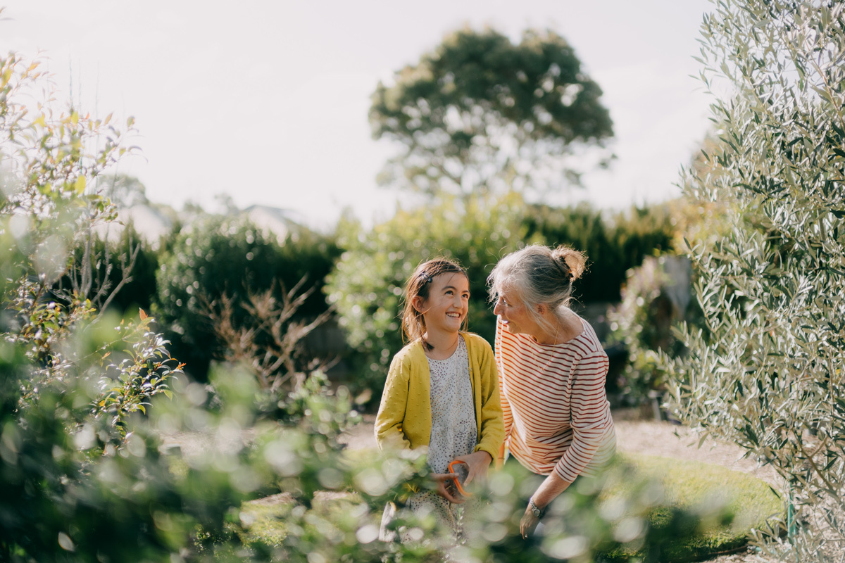 Grandmother and granddaughter in the garden