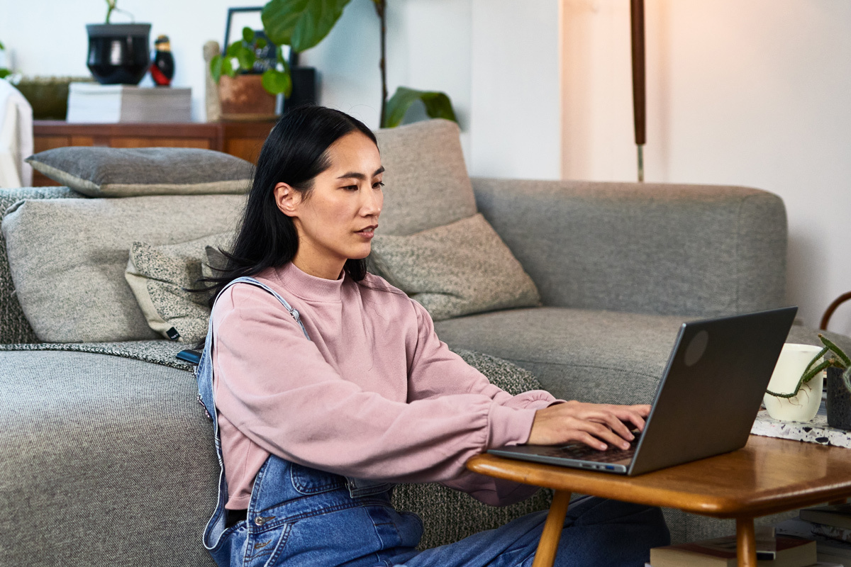 Women looking at her laptop at home