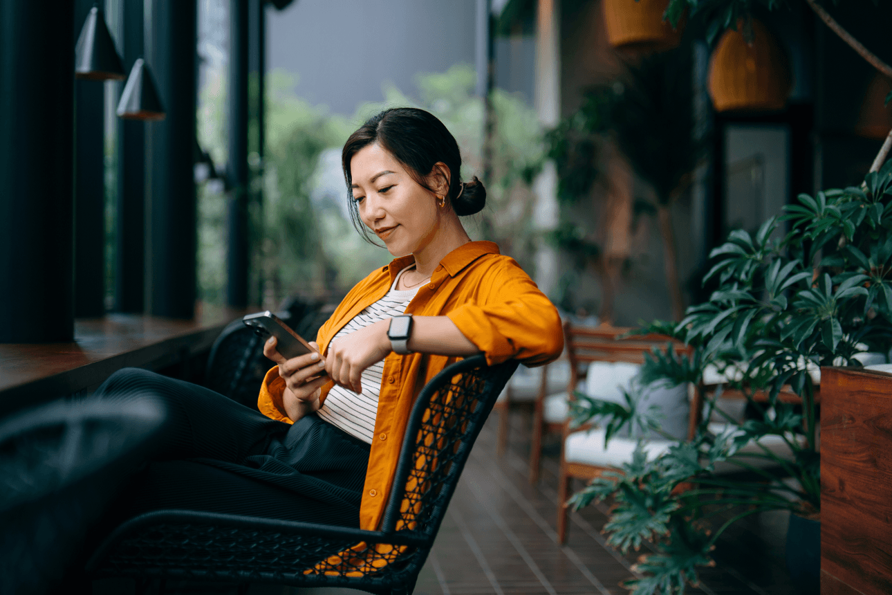 Young female on her phone in a cafe