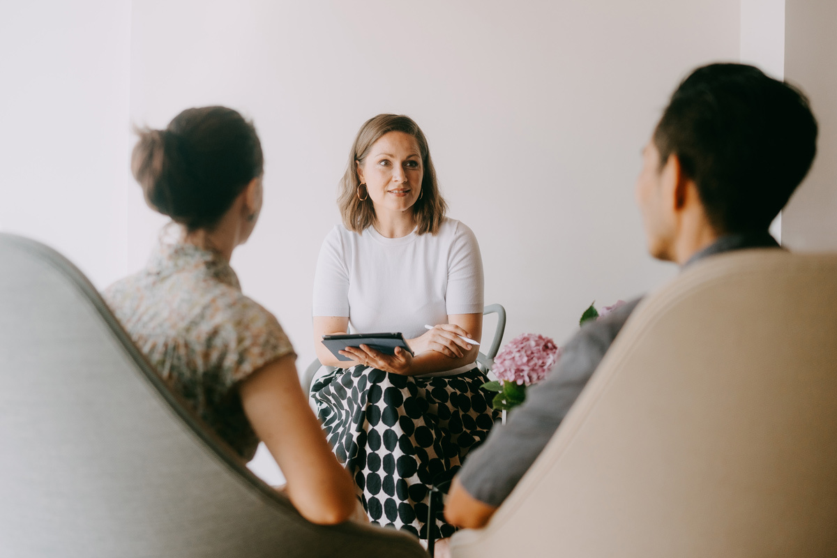 Couple sitting down with their adviser