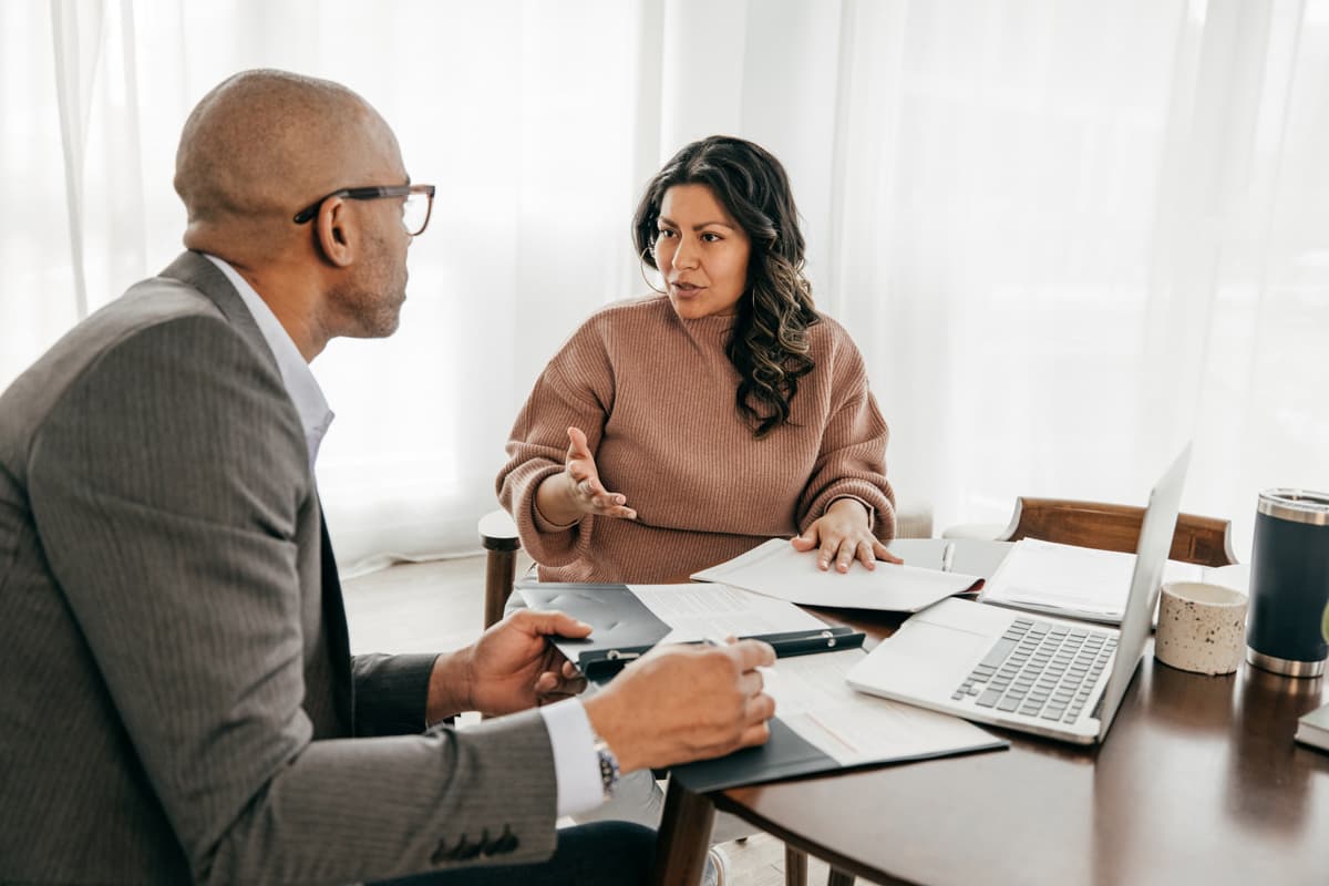 Male adviser and female client in discussion