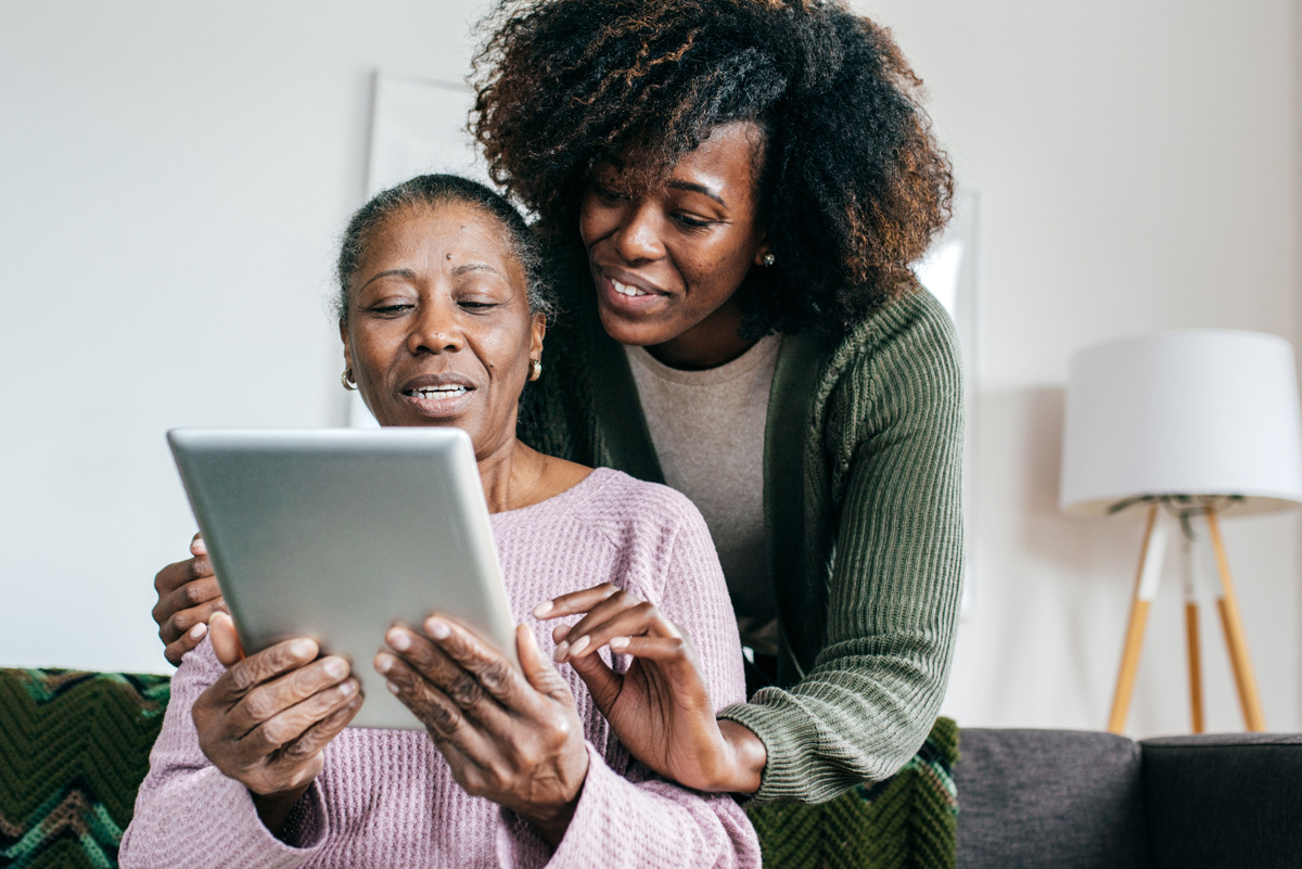 Two women looking at a tablet