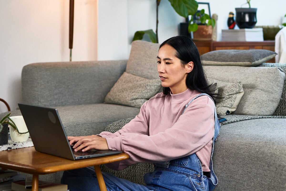 Women looking at her laptop at home
